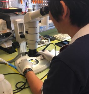 Tien is soldering parts for a spectrometer
